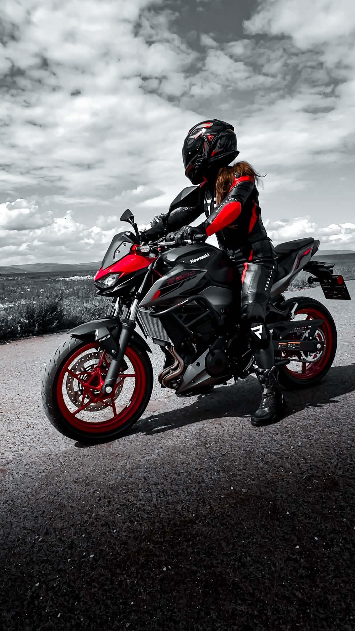 A rider stopped on an open road at the end of a ride